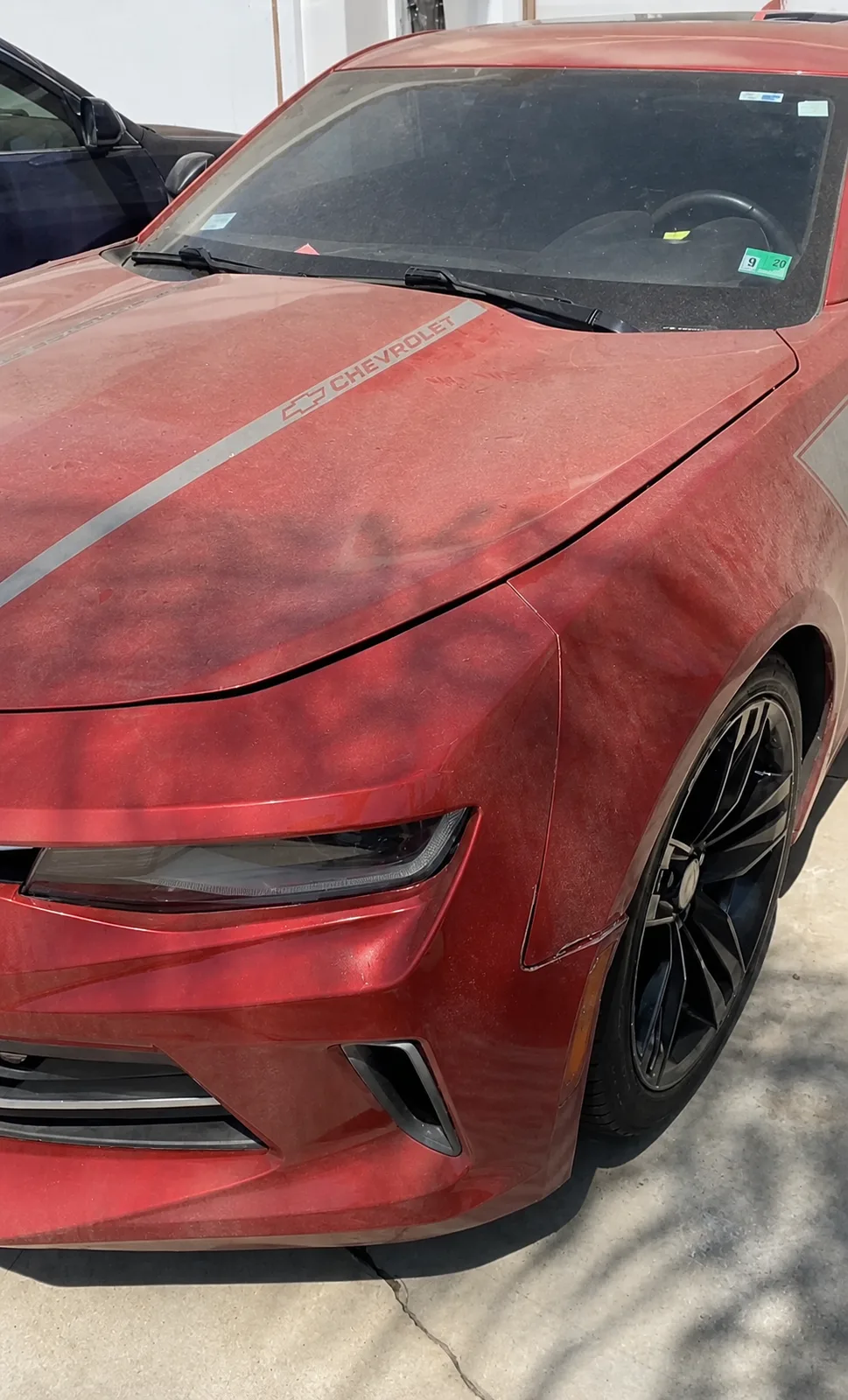 Before — Red Chevrolet Camaro hood and front fender — dusty, faded finish, then deep candy-red gloss